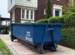 Blue Peeps Containers 20-yard dumpster rental in Atlanta placed in a residential driveway