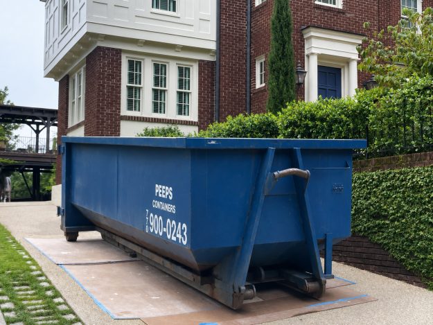 20-yard-dumpster-rental-atlanta-driveway Blue Peeps Containers 20-yard dumpster rental in Atlanta placed in a residential driveway