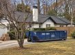 Peeps Containers roll-off dumpster at an Atlanta-area home during a basement cleanout