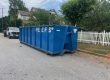 Peeps Containers roll-off dumpster at a residential yard cleanup in College Park, Georgia