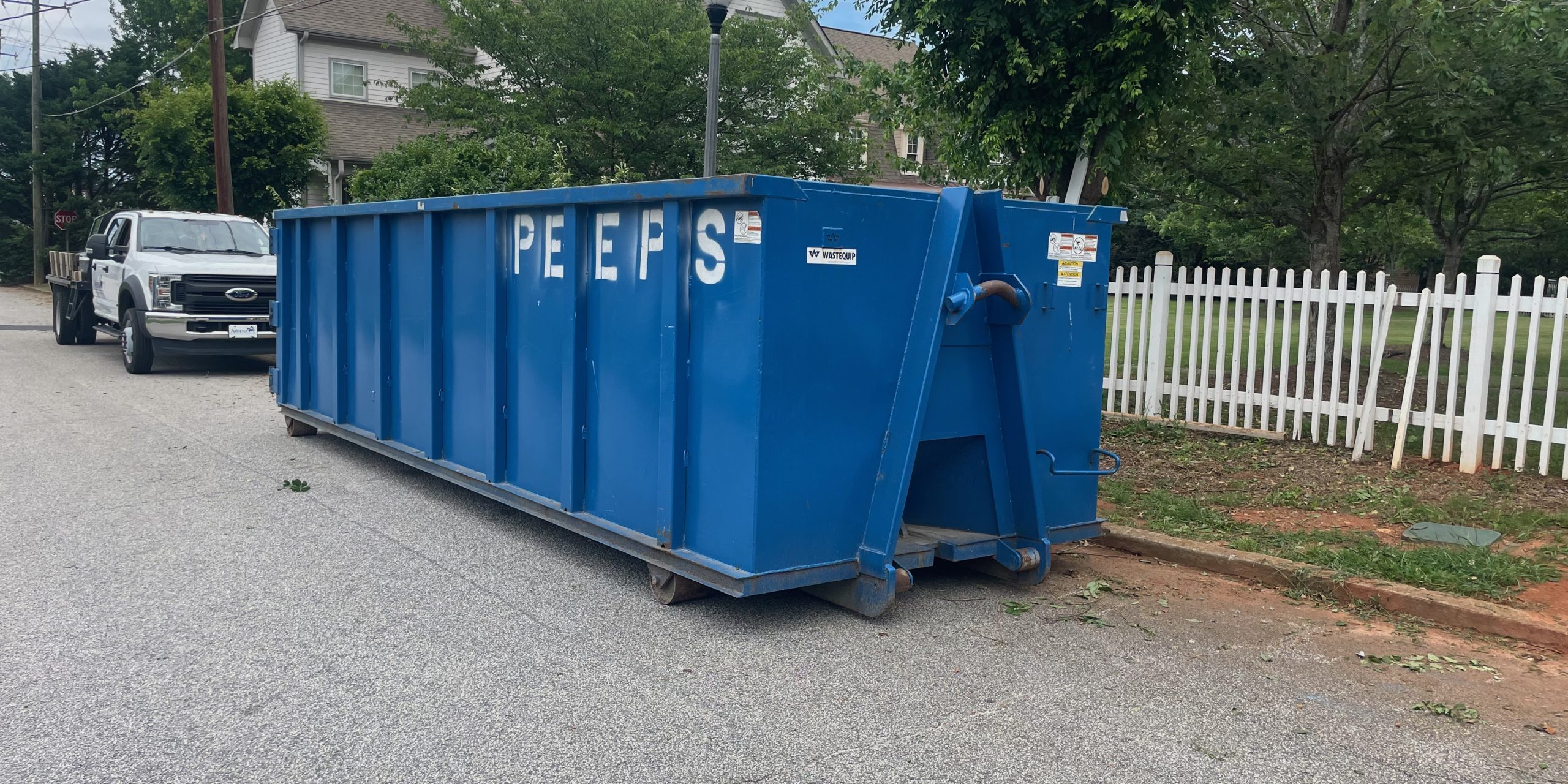 College Park Yard Cleanup Dumpster – Peeps Containers Peeps Containers roll-off dumpster at a residential yard cleanup in College Park, Georgia