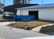 15-yard Peeps Containers roll-off dumpster at a warehouse remodel in Fairburn, Georgia