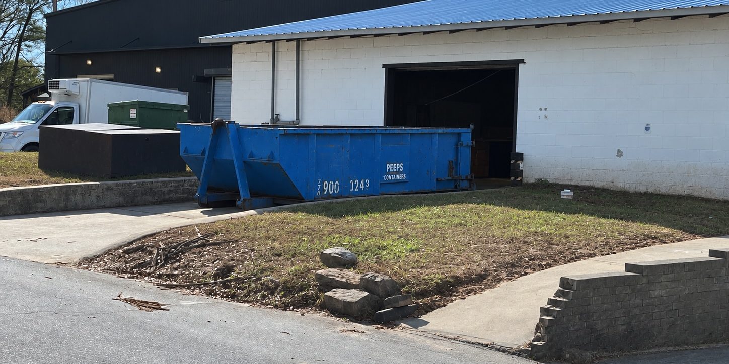 Fairburn Warehouse Remodel 15-Yard Dumpster – Peeps Containers 15-yard Peeps Containers roll-off dumpster at a warehouse remodel in Fairburn, Georgia