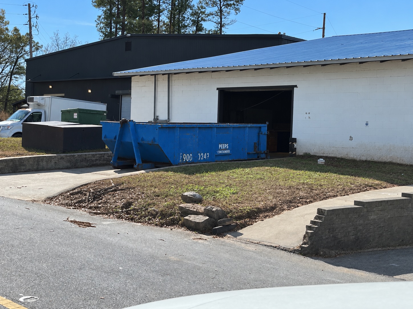 Fairburn Warehouse Remodel 15-Yard Dumpster – Peeps Containers - Peeps Containers 15-yard Peeps Containers roll-off dumpster at a warehouse remodel in Fairburn, Georgia