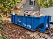 15-yard Peeps Containers roll-off dumpster at a restoration cleanup project in Fayetteville, Georgia